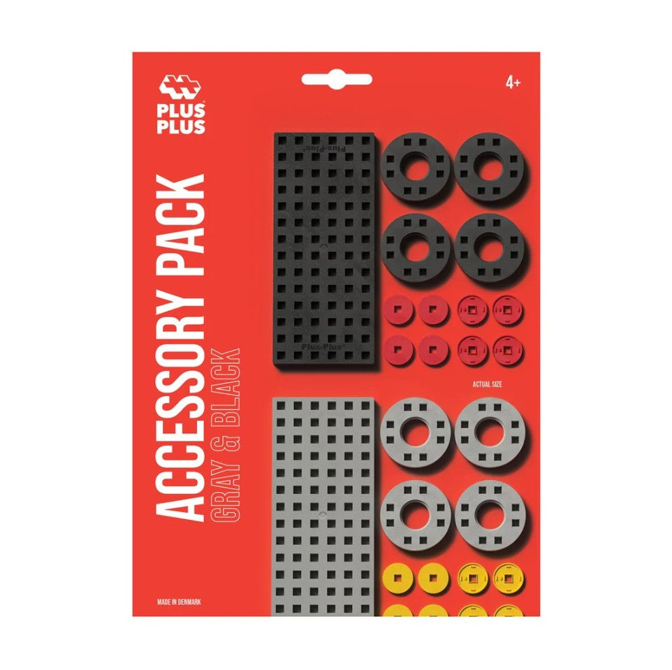 Plus Plus accessory pack with gray and black pieces on a red background
