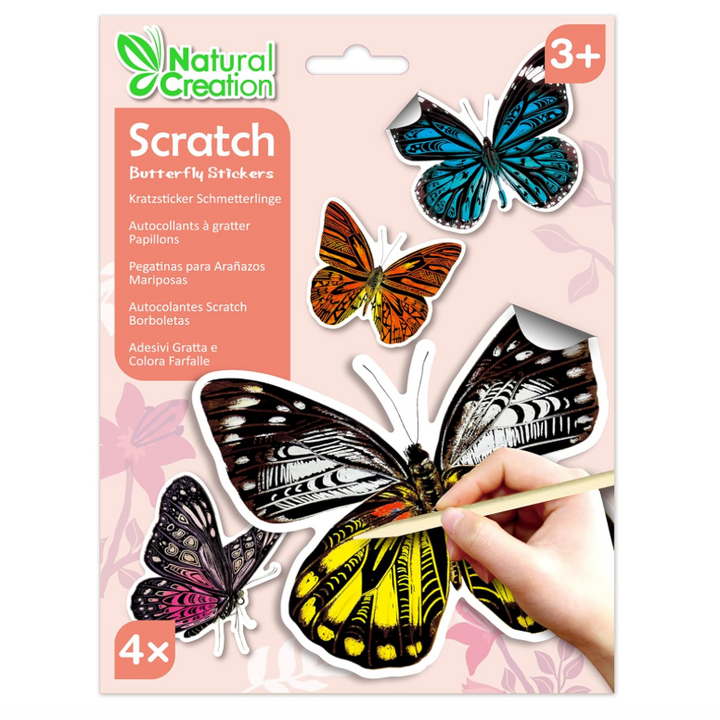 Natural Creation Scratch Butterfly Stickers in a 4-pack, featuring colorful butterfly designs on a pink card with a hand using a wooden stick to scratch on the main butterfly sticker.